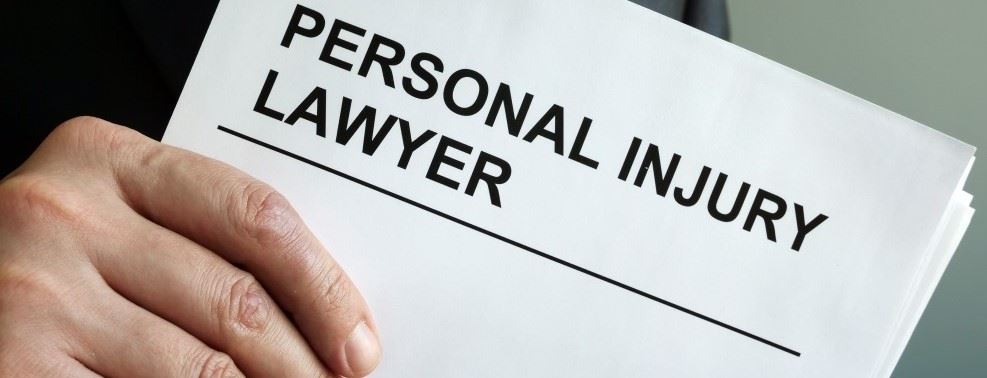 Personal Injury Attorney Holding Booklet