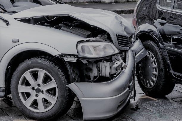 two wrecked cars after a crash